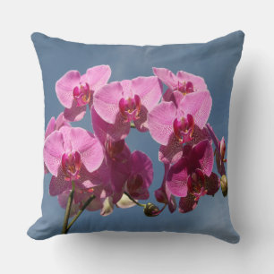 Magenta Phalaenopsis Orchids Against Blue Sky Throw Pillow