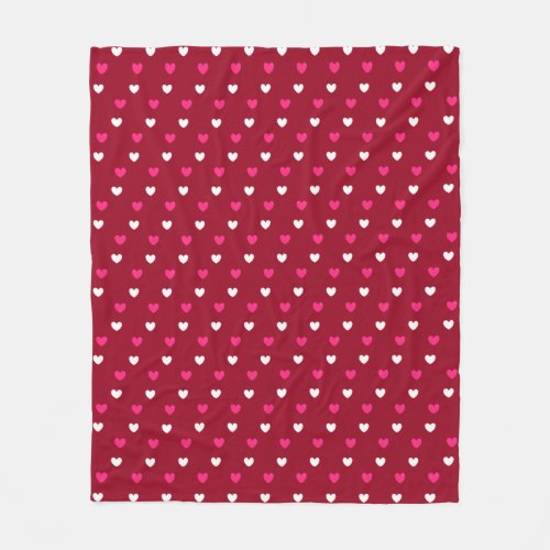 Magenta red and white hearts on burgundy fleece blanket
