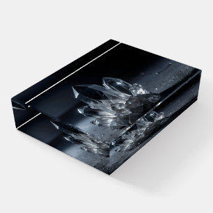Magic crystals on a black background in glass paperweight