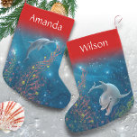 Magical Dolphin Unique Beach Themed Name Small Christmas Stocking<br><div class="desc">Dive into the holiday spirit this year with enchanting dolphin christmas stockings, designed with original watercolor art by Raphaela Wilson that captures the whimsical spirit of these elegant porpoises. Each custom stocking is a canvas of beach holiday joy, depicting vibrant colors and a playful scene of dolphins decorating under the...</div>
