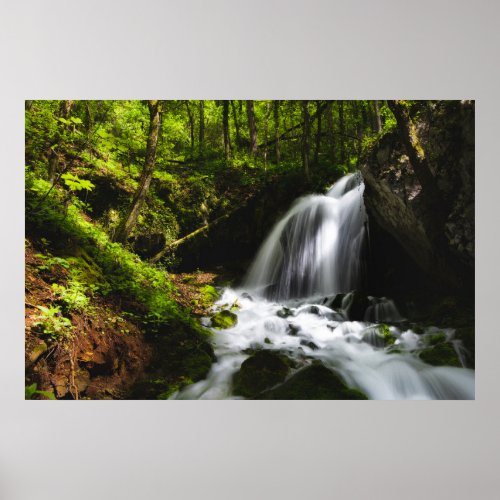 Magical waterfall in enchanting green forest poster