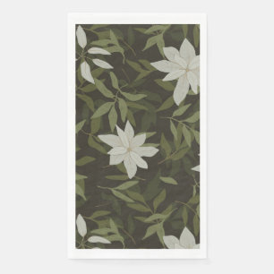 Magnolia and green leaves on black paper guest towels
