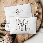Maid of Honor Flower Letter Boho Floral Custom Accessory Pouch<br><div class="desc">Maid of Honor accessory bag to personalize. Maid of Honor is lettered with neutral boho floral letters and handwritten script. You can also add the name of the bride and groom and their wedding date, which frames a co-ordinating floral ampersand. Lovely wedding party keepsake gift and perfect for a fall...</div>