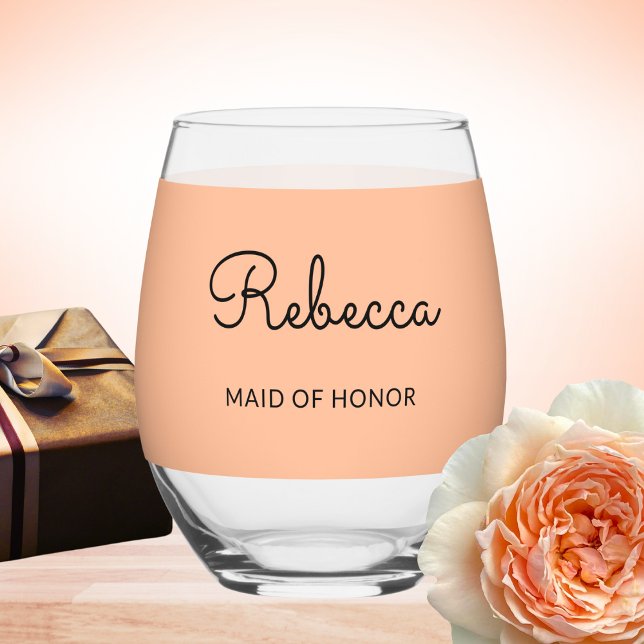 Maid of Honor Monogram Wedding Elegant Chic Peach Stemless Wine Glass (A pretty stemless wine glass with personalized name and 'Maid of Honor' words on a peach background)