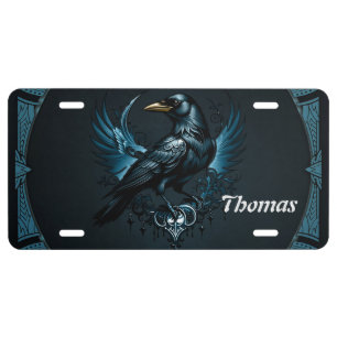 Majestic black raven sitting on an ornate license plate