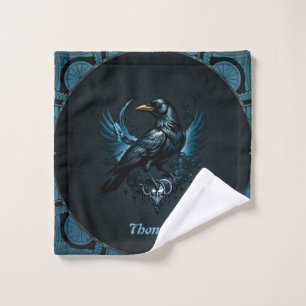Majestic black raven sitting on an ornate wash cloth