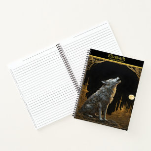 Majestic wolf howling beneath a luminous full moon notebook