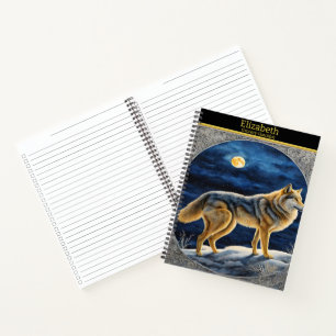 Majestic wolf howling under the bright full moon notebook