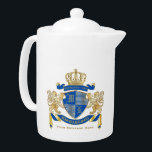 Make Your Own Coat of Arms Blue Gold Lion Emblem Teapot<br><div class="desc">Create your very own aristocratic Coat of Arms, Emblem, Insignia or Family Crest with this beautiful, classic escutcheon or shield design. Cobalt Blue patterns decorate a shield topped with golden crown and flanked by medieval heraldic lion or griffin. A matching top banner holds your custom wedding date / birth date...</div>