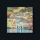 Malcesine on Lake Garda By Gustav Klimt Canvas Print<br><div class="desc">Malcesine on Lake Garda (1913) by Gustav Klimt is a vintage Victorian Era Art Nouveau fine art symbolism painting. A beautiful view of the Italian city of Malcesine with buildings and houses on the edge of the harbor. The homes and boats cast a reflection in the calm water. You can...</div>