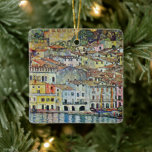 Malcesine on Lake Garda By Gustav Klimt Ceramic Ornament<br><div class="desc">Malcesine on Lake Garda (1913) by Gustav Klimt is a vintage Victorian Era Art Nouveau fine art symbolism painting. A beautiful view of the Italian city of Malcesine with buildings and houses on the edge of the harbor. The homes and boats cast a reflection in the calm water. You can...</div>