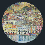 Malcesine on Lake Garda By Gustav Klimt Classic Round Sticker<br><div class="desc">Malcesine on Lake Garda (1913) by Gustav Klimt is a vintage Victorian Era Art Nouveau fine art symbolism painting. A beautiful view of the Italian city of Malcesine with buildings and houses on the edge of the harbor. The homes and boats cast a reflection in the calm water. You can...</div>