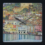 Malcesine on Lake Garda By Gustav Klimt Square Wall Clock<br><div class="desc">Malcesine on Lake Garda (1913) by Gustav Klimt is a vintage Victorian Era Art Nouveau fine art symbolism painting. A beautiful view of the Italian city of Malcesine with buildings and houses on the edge of the harbor. The homes and boats cast a reflection in the calm water. You can...</div>