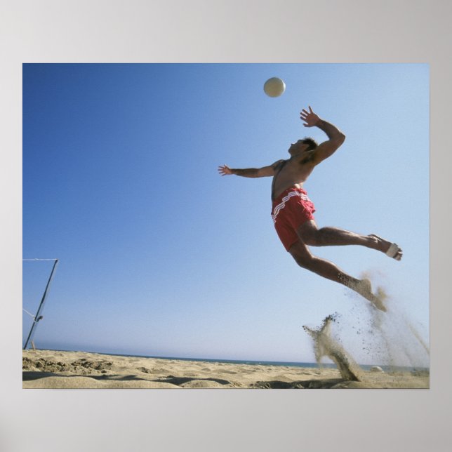 Male beach volleyball player jumping up to spike poster (Front)