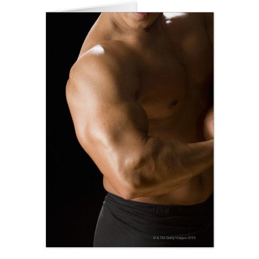 Male bodybuilder flexing muscles, front view, 2 cards (Front)