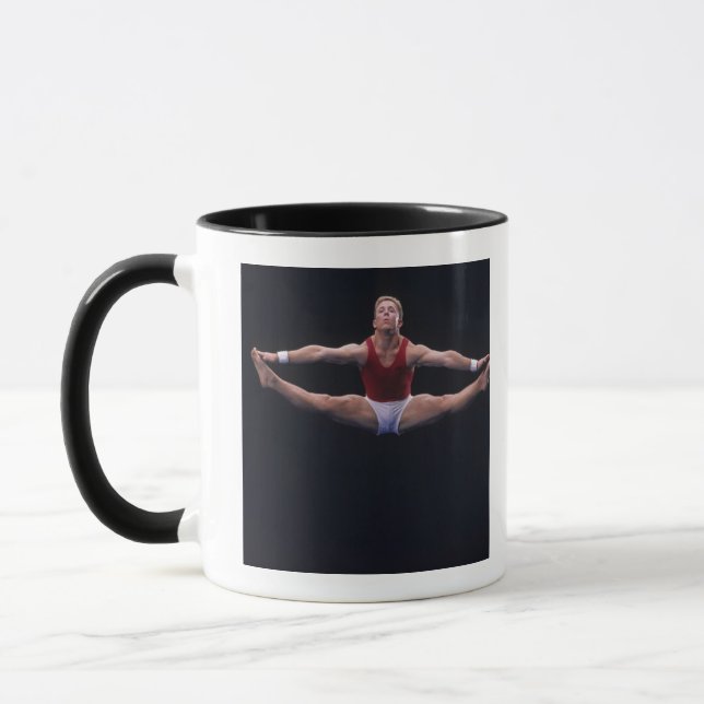 Male gymnast performing on the floor exercise mug (Left)