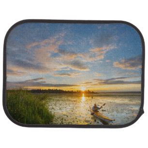 Male kayaker paddling sea kayak on still water car floor mat