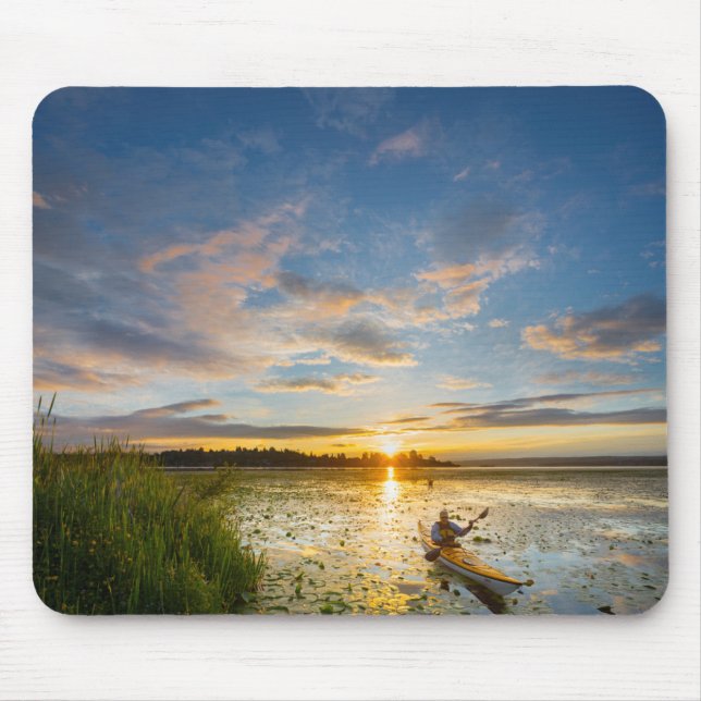 Male kayaker paddling sea kayak on still water mouse pad (Front)