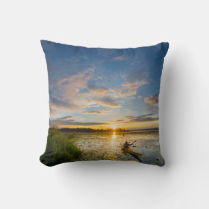 Male kayaker paddling sea kayak on still water throw pillow