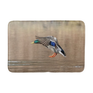 Mallard Duck in flight Bath Mat