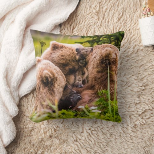 Mama bear nursing her two cubs Lake Clark Nationa Throw Pillow