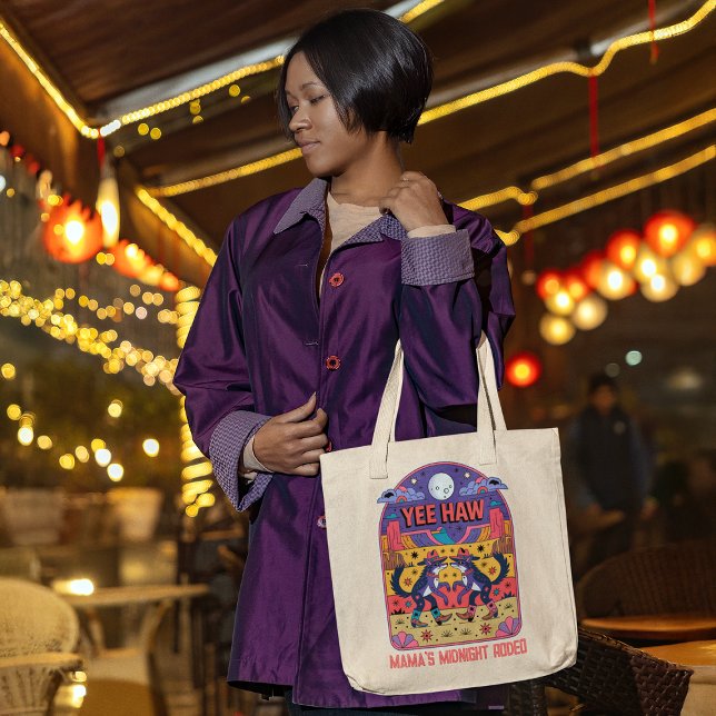 Mama's Midnight Rodeo Funny Mom Life Yee Haw Tote Bag (woman carrying a tote bag shopping at a late night market after the kids are in bed)