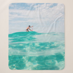 Man doing surfing sherpa blanket
