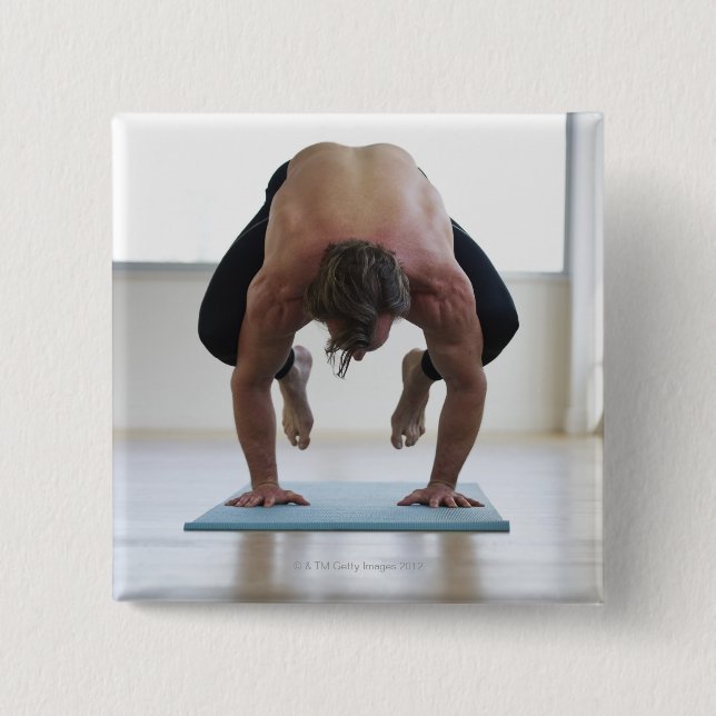 Man doing workout on yoga mat button (Front)