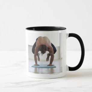 Man doing workout on yoga mat mug