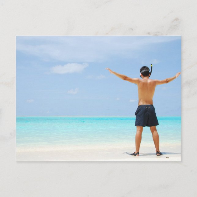 man getting ready to go snorkeling in a tropical i postcard (Front)