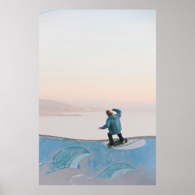 Man in blue skateboarding on wall in beach poster (Front)