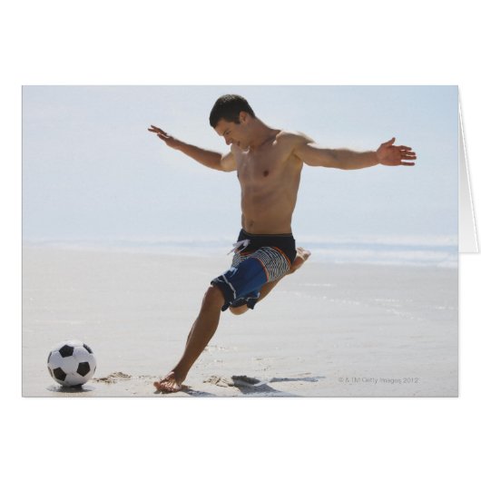 Man kicking soccer ball on beach cards (Front Horizontal)