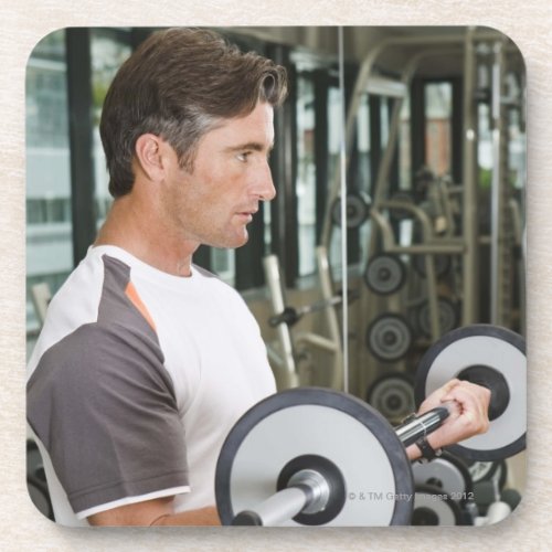 Man lifting weights in gym 2 beverage coaster