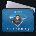 Man of Steel in Flight Laptop Sleeve<br><div class="desc">Take to the skies with the ultimate symbol of heroism! This dynamic Superman design features the legendary Kryptonian bursting through his iconic S-shield, fist forward, eyes locked on justice. Set against a vivid blue background with fluffy clouds, the artwork captures the unstoppable energy of Superman in full flight—ready to save...</div>