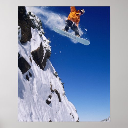 Man on a snowboard jumping off a cornice at poster