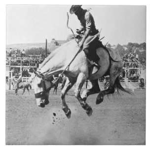 Man riding bucking horse in rodeo ceramic tile