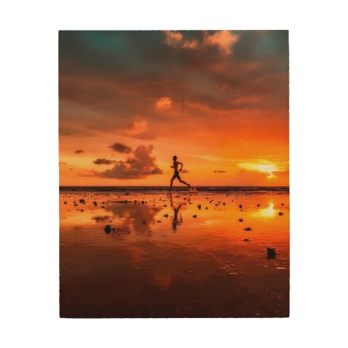 Man Running on Beach at Sunset Wood Wall Art