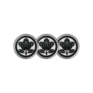 Mandarin orange in a circle golf ball marker
