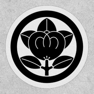 Mandarin orange in a circle golf ball marker patch