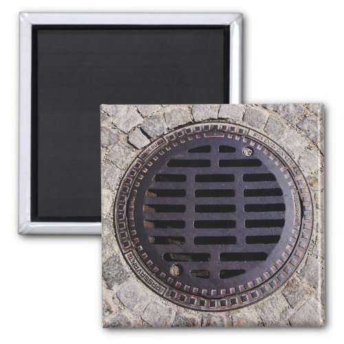 Manhole cover and cobblestone road magnet