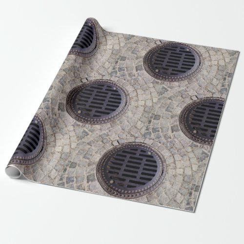 Manhole cover and cobblestone road wrapping paper