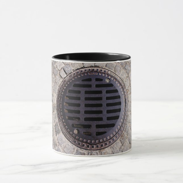 Manhole cover cobblestone road metal grate gray  mug (Center)