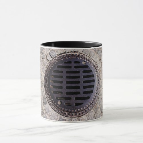 Manhole cover cobblestone road metal grate mug