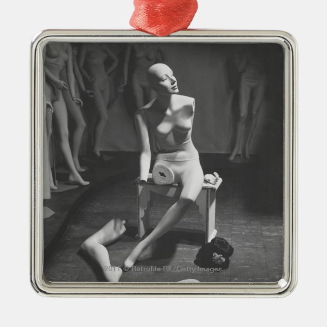 Mannequin with leg and arm removed metal ornament (Front)