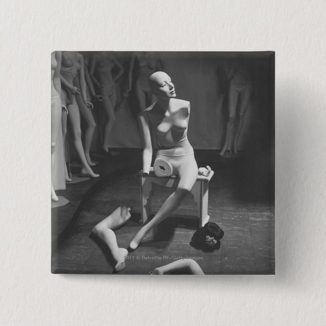 Mannequin with leg and arm removed pinback button (Front)