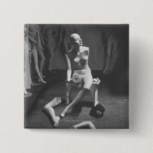 Mannequin with leg and arm removed pinback button