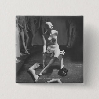 Mannequin with leg and arm removed pinback button