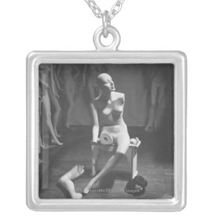 Mannequin with leg and arm removed silver plated necklace