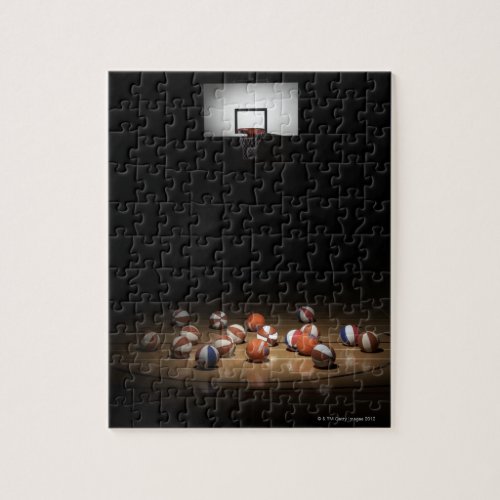 Many basketballs resting on the floor jigsaw puzzle
