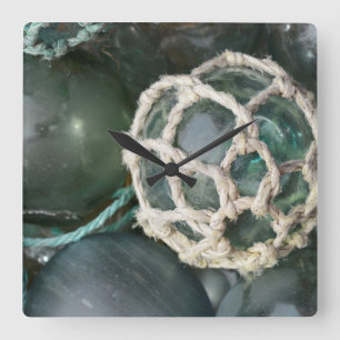 Many glass fishing floats, Alaska Square Wall Clock